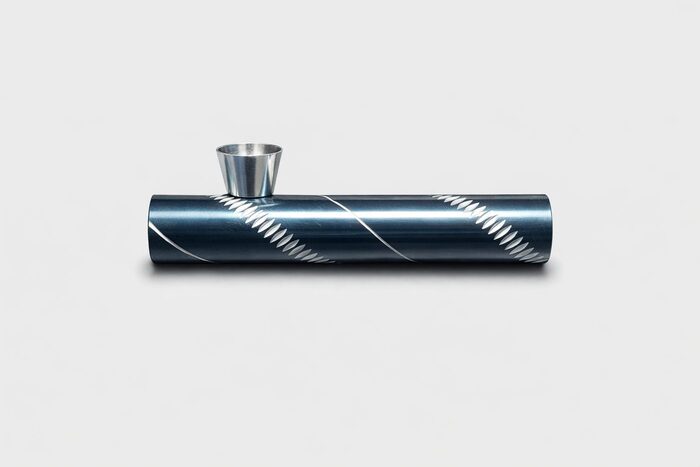 Spiral pattern metal tobacco pipe with handmade detailing.